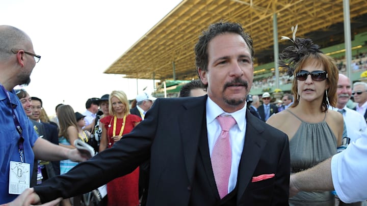 November 3, 2012; Arcadia, CA, USA; Broadcaster Jim Rome celebrates Mike Smith winning race seven of the 2012 Breeders' Cup Championships at Santa Anita Park. 