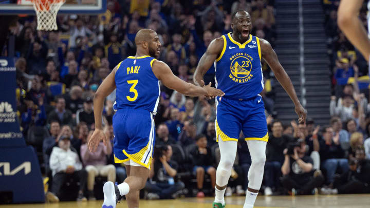 Mar 9, 2024; San Francisco, California, USA; Golden State Warriors forward Draymond Green (23) celebrates his three-point basket with teammate Chris Paul (3) during the first quarter against the San Antonio Spurs at Chase Center. Mandatory Credit: D. Ross Cameron-USA TODAY Sports