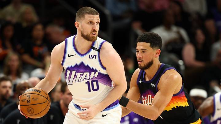 Mar 28, 2026; Phoenix, Arizona, USA; Utah Jazz guard Svi Mykhailiuk (10) moves the ball against Phoenix Suns guard Devin Booker (1) in the second half at Mortgage Matchup Center. Mandatory Credit: Mark J. Rebilas-Imagn Images Mar 28, 2026; Phoenix, Arizona, USA; Utah Jazz guard Svi Mykhailiuk (10) moves the ball against Phoenix Suns guard Devin Booker (1) in the second half at Mortgage Matchup Center. Mandatory Credit: Mark J. Rebilas-Imagn Images