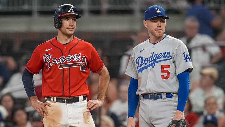 Jun 24, 2022; Cumberland, Georgia, USA; Atlanta Braves first baseman Matt Olson (28) on base next to Los Angeles Dodgers first baseman Freddie Freeman (5) during the ninth inning at Truist Park. Mandatory Credit: Dale Zanine-Imagn Images