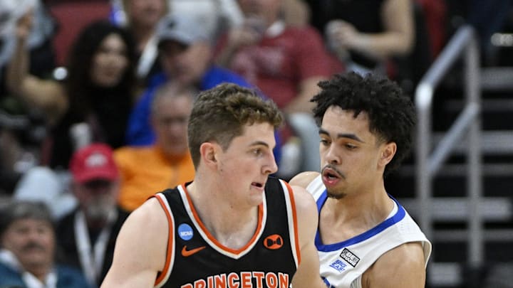 Mar 24, 2023; Louisville, KY, USA; Princeton Tigers forward Caden Pierce (12) drives against Creighton. 