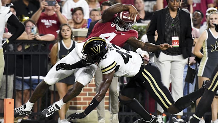 Sep 24, 2022; Tuscaloosa, Alabama, USA; Vanderbilt Commodores linebacker De'Rickey Wright (43) drives Alabama Crimson Tide quarterback Jalen Milroe (4) out of bounds short of the goal line at Bryant-Denny Stadium. Alabama won 55-3. Mandatory Credit: Gary Cosby Jr.-Imagn Images Sep 24, 2022; Tuscaloosa, Alabama, USA; Vanderbilt Commodores linebacker De'Rickey Wright (43) drives Alabama Crimson Tide quarterback Jalen Milroe (4) out of bounds short of the goal line at Bryant-Denny Stadium. Alabama won 55-3. Mandatory Credit: Gary Cosby Jr.-Imagn Images