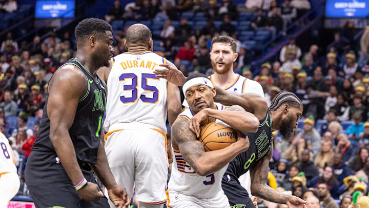 Jan 19, 2024; New Orleans, Louisiana, USA;  Phoenix Suns guard Bradley Beal (3) grabs a rebound from New Orleans Pelicans forward Naji Marshall (8) during the second half at Smoothie King Center. Mandatory Credit: Stephen Lew-Imagn Images