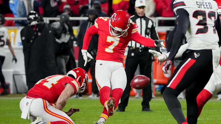 Dec 7, 2025; Kansas City, Missouri, USA; Kansas City Chiefs place kicker Harrison Butker (7) makes a field goal from the hold of Kansas City Chiefs punter Matt Araiza (14).