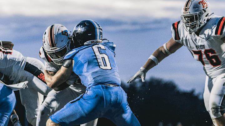 Hagerty linebacker Ryan Davis (6) bottles up an Oviedo runner in last year's annual showdown between the two city schools. An incoming senior, Davis is expected to be among the defensive leaders this fall for the Huskies.