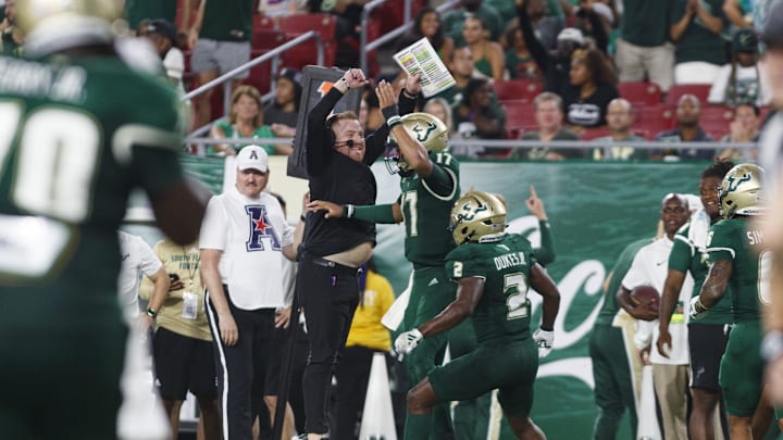Sep 9, 2023; Tampa, Florida, USA; South Florida Bulls head coach Alex Golesh celebrates quarterback Byrum Brown (17) touchdown against Florida A&M Rattlers during the third quarter at Raymond James Stadium. Mandatory Credit: Morgan Tencza-USA TODAY Sports