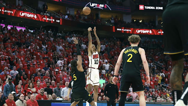May 4, 2025; Houston, Texas, USA; Houston Rockets forward Jabari Smith Jr. (10) shoots the ball as Golden State Warriors forward Kevon Looney (5) defends during the third quarter of game seven of the first round for the 2025 NBA Playoffs at Toyota Center. Mandatory Credit: Troy Taormina-Imagn Images