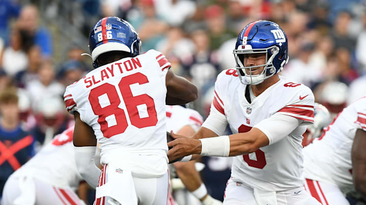 Aug 11, 2022; Foxborough, Massachusetts, USA; New York Giants quarterback Daniel Jones (8) hands the