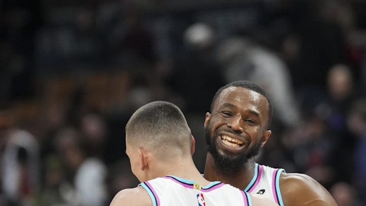 Feb 21, 2025; Toronto, Ontario, CAN; Miami Heat guard Tyler Herro (14) and Miami Heat forward Andrew Wiggins (22) celebrate defeating the Toronto Raptors at Scotiabank Arena. Mandatory Credit: Kevin Sousa-Imagn Images