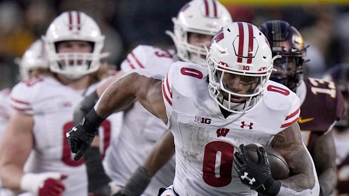 Nov 25, 2023; Minneapolis, Minnesota, USA; Wisconsin Badgers running back Braelon Allen (0) runs the ball against the Minnesota Golden Gophers during the third quarter at Huntington Bank Stadium. Wisconsin won 28-14. Mandatory Credit: Mark Hoffman/Milwaukee Journal Sentinel via USA TODAY NETWORK