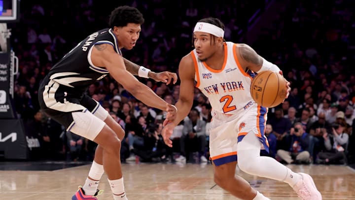 Jan 12, 2025; New York, New York, USA; New York Knicks guard Miles McBride (2) controls the ball against Milwaukee Bucks forward MarJon Beauchamp (3) during the second quarter at Madison Square Garden. Mandatory Credit: Brad Penner-Imagn Images