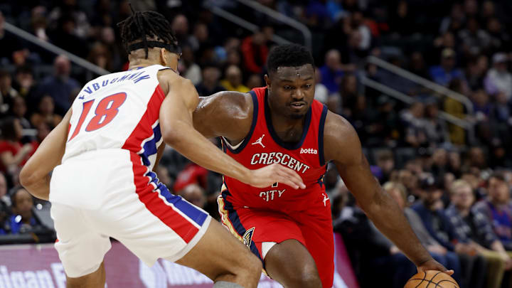Mar 24, 2024; Detroit, Michigan, USA;  New Orleans Pelicans forward Zion Williamson (1) dribbles on Detroit Pistons forward Tosan Evbuomwan (18) in the first half at Little Caesars Arena. Mandatory Credit: Rick Osentoski-Imagn Images