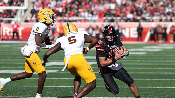 Nov 4, 2023; Salt Lake City, Utah, USA; Utah Utes quarterback Bryson Barnes (16) runs the ball against Arizona State Sun Devils defensive back Ro Torrence (9) and defensive back Chris Edmonds (5) in the second quarter at Rice-Eccles Stadium. Mandatory Credit: Rob Gray-Imagn Images Nov 4, 2023; Salt Lake City, Utah, USA; Utah Utes quarterback Bryson Barnes (16) runs the ball against Arizona State Sun Devils defensive back Ro Torrence (9) and defensive back Chris Edmonds (5) in the second quarter at Rice-Eccles Stadium. Mandatory Credit: Rob Gray-Imagn Images