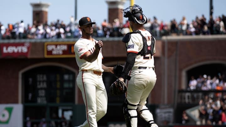 Jun 8, 2025; San Francisco, California, USA; San Francisco Giants pitcher Camilo Doval (75) and catcher Andrew Knizner (21) celebrate their 4-3 victory over the Atlanta Braves at Oracle Park. Jun 8, 2025; San Francisco, California, USA; San Francisco Giants pitcher Camilo Doval (75) and catcher Andrew Knizner (21) celebrate their 4-3 victory over the Atlanta Braves at Oracle Park.