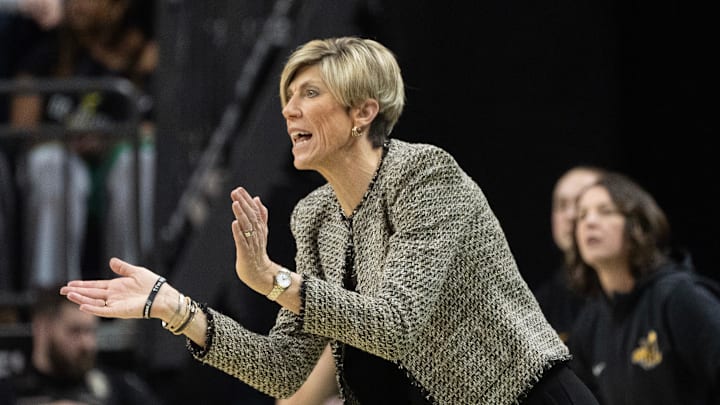 Iowa coach Jan Jensen cheers on her team against Oregon at Matthew Knight Arena Sunday, Jan. 19, 2025. Iowa coach Jan Jensen cheers on her team against Oregon at Matthew Knight Arena Sunday, Jan. 19, 2025.