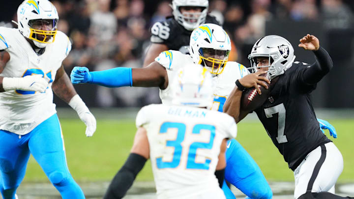 Sep 15, 2025; Paradise, Nevada, USA;  Las Vegas Raiders quarterback Geno Smith (7) rushes the ball during the second quarter against the Los Angeles Chargers at Allegiant Stadium. Mandatory Credit: Stephen R. Sylvanie-Imagn Images