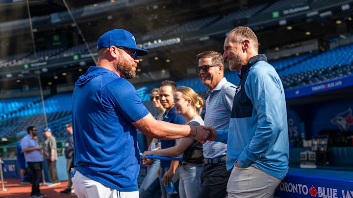 Jays Manager John Schneider speaking with GM Ross Atkins and CEO Mark Shapiro