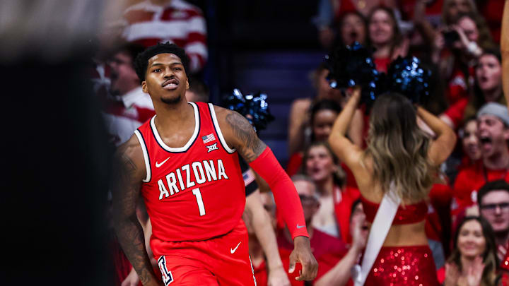 Feb 22, 2025; Tucson, Arizona, USA; Arizona Wildcats guard Caleb Love (1) reacts after dunking the ball during the first half against the BYU Cougars at McKale Center. Mandatory Credit: Aryanna Frank-Imagn Images
