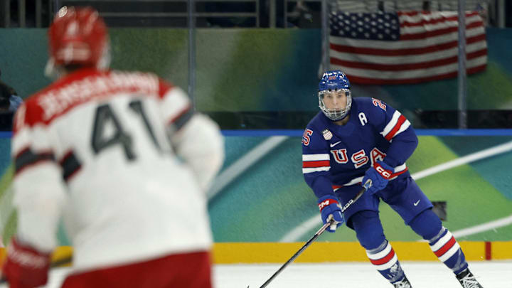 Feb 14, 2026; Milan, Italy;  Charlie McAvoy of United States in action against Denmark in men's ice hockey group C play during the Milano Cortina 2026 Olympic Winter Games at Milano Santagiulia Ice Hockey Arena. Mandatory Credit: Geoff Burke-Imagn Images