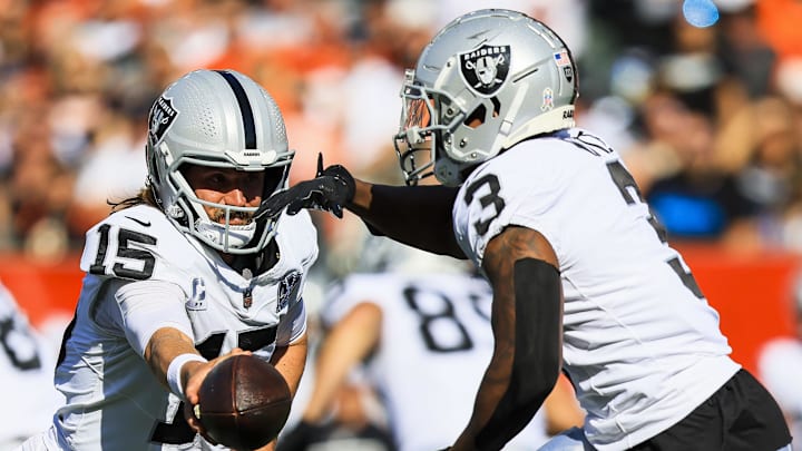 Nov 3, 2024; Cincinnati, Ohio, USA; Las Vegas Raiders quarterback Gardner Minshew (15) hands the ball off to running back Zamir White (3) in the first half against the Cincinnati Bengals at Paycor Stadium. Mandatory Credit: Katie Stratman-Imagn Images Nov 3, 2024; Cincinnati, Ohio, USA; Las Vegas Raiders quarterback Gardner Minshew (15) hands the ball off to running back Zamir White (3) in the first half against the Cincinnati Bengals at Paycor Stadium. Mandatory Credit: Katie Stratman-Imagn Images
