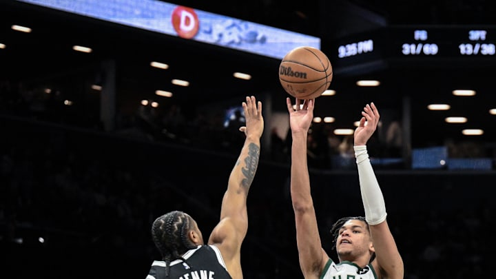 Apr 7, 2026; Brooklyn, New York, USA; Milwaukee Bucks forward Ousmane Dieng (21) shoots the ball while defended by Brooklyn Nets guard Tyson Etienne (10) during the second half at Barclays Center. Mandatory Credit: John Jones-Imagn Images