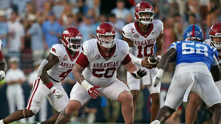 Sep 13, 2025; Oxford, Mississippi, USA; Arkansas Razorback offensive lineman Kobe Branham (50) blocks during the second quarter against the Mississippi Rebels at Vaught-Hemingway Stadium. Mandatory Credit: Petre Thomas-Imagn Images Sep 13, 2025; Oxford, Mississippi, USA; Arkansas Razorback offensive lineman Kobe Branham (50) blocks during the second quarter against the Mississippi Rebels at Vaught-Hemingway Stadium. Mandatory Credit: Petre Thomas-Imagn Images