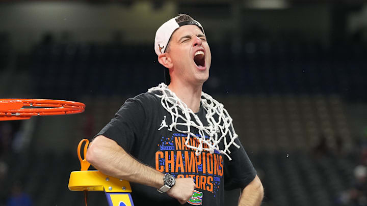 Apr 7, 2025; San Antonio, TX, USA;  Florida Gators head coach Todd Golden celebrates as he cuts down the net after defeating the Houston Cougars in the national championship game of the Final Four of the 2025 NCAA Tournament at the Alamodome. Mandatory Credit: Robert Deutsch-Imagn Images