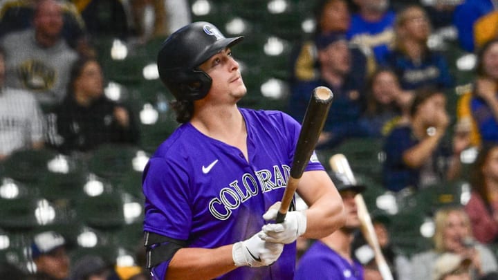 Sep 6, 2024; Milwaukee, Wisconsin, USA; Colorado Rockies first baseman Michael Toglia (4) hits a three-run home run in the sixth inning against the Milwaukee Brewers at American Family Field. Mandatory Credit: Benny Sieu-Imagn Images