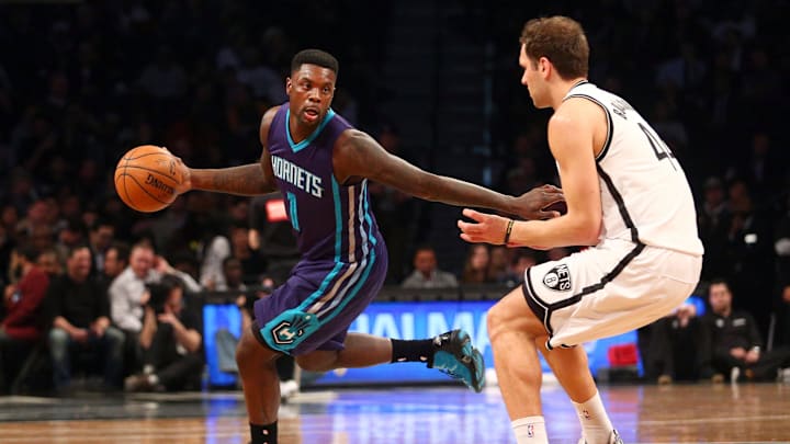 Mar 4, 2015; Brooklyn, NY, USA; Charlotte Hornets shooting guard Lance Stephenson (1) controls the ball against Brooklyn Nets shooting guard Bojan Bogdanovic (44) during the second quarter at Barclays Center. Mandatory Credit: Brad Penner-Imagn Images