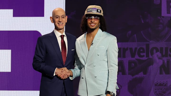 Jun 26, 2024; Brooklyn, NY, USA; Devin Carter poses for photos with NBA commissioner Adam Silver after being selected in the first round by the Sacramento Kings in the 2024 NBA Draft at Barclays Center. 