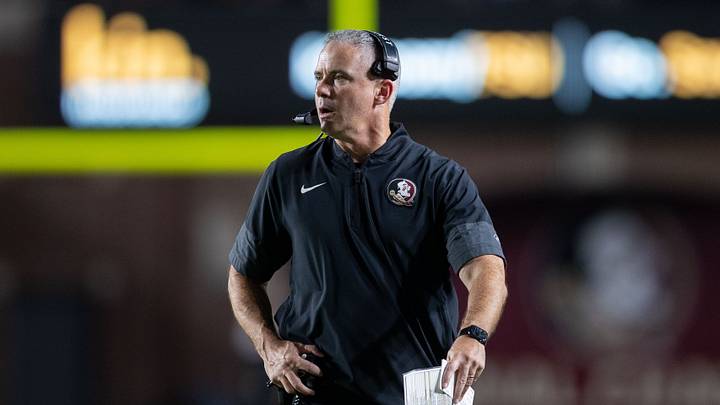 Florida State Seminoles head coach Mike Norvell talks into his headset during a timeout. The Florida State Seminoles defeated the New Mexico State Aggies 34-17 at Doak Campbell Stadium on Saturday, Aug. 29, 2026.