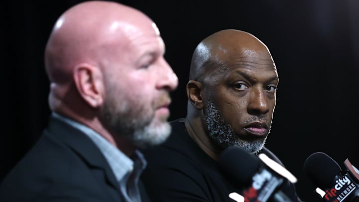 Apr 13, 2025; Portland, Oregon, USA;  Portland Trail Blazers head coach Chauncey Billups (right) listens to Trail Blazers’ general manager Joe Cronin answer a question during a press conference before Portland plays their last season game against Los Angeles Lakers at Moda Center. Mandatory Credit: Jaime Valdez-Imagn Images
