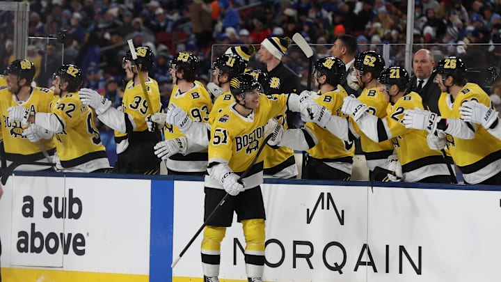 Feb 1, 2026; Tampa Bay, Florida, USA; Boston Bruins center Matthew Poitras (51) celebrates a goal against the Tampa Bay Lightning with the bench during the second period in the 2026 Stadium Series ice hockey game at Raymond James Stadium. Mandatory Credit: Kim Klement Neitzel-Imagn Images