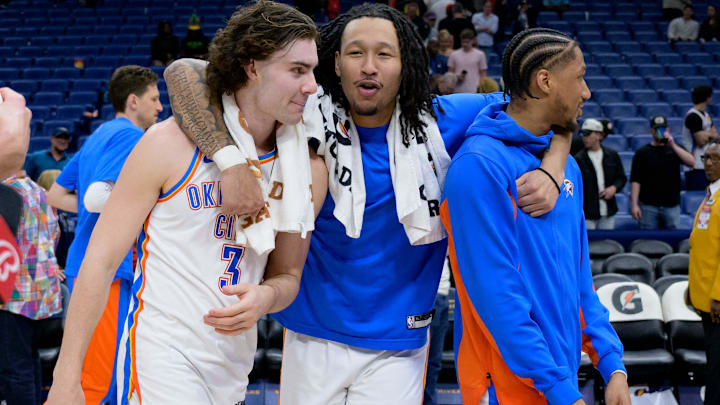 Mar 26, 2024; New Orleans, Louisiana, USA; Oklahoma City Thunder guard Josh Giddey (3), left, forward Jaylin Williams, and guard Aaron Wiggins celebrate after their victory over the against the New Orleans Pelicans at Smoothie King Center. Mandatory Credit: Matthew Hinton-Imagn Images Mar 26, 2024; New Orleans, Louisiana, USA; Oklahoma City Thunder guard Josh Giddey (3), left, forward Jaylin Williams, and guard Aaron Wiggins celebrate after their victory over the against the New Orleans Pelicans at Smoothie King Center. Mandatory Credit: Matthew Hinton-Imagn Images