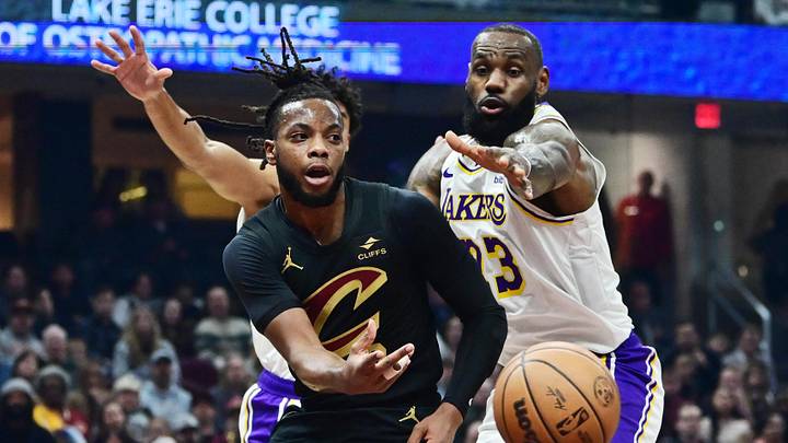 Nov 25, 2023; Cleveland, Ohio, USA; Cleveland Cavaliers guard Darius Garland (10) passes as Los Angeles Lakers forward LeBron James (23) defends during the first half at Rocket Mortgage FieldHouse. Mandatory Credit: Ken Blaze-Imagn Images