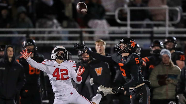West De Pere High School's Nolan Sell (5) breaks up a pass intended for Union Grove High School's Nathan Tucker (42) during a WIAA Division 2 state quarterfinal on Friday, November 7, 2025, at West De Pere High School in De Pere, Wis. De Pere won the game, 42-14.
Tork Mason/USA TODAY NETWORK-Wisconsin