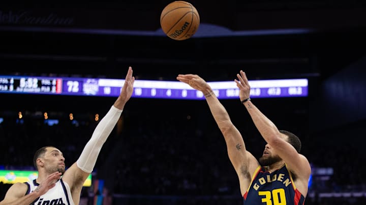 Mar 13, 2025; San Francisco, California, USA; Golden State Warriors guard Stephen Curry (30) shoots over Sacramento Kings guard Zach LaVine (8) during the third quarter at Chase Center. Mandatory Credit: D. Ross Cameron-Imagn Images