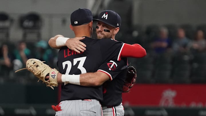 Sep 23, 2025; Arlington, Texas, USA; Minnesota Twins third baseman Royce Lewis (23) and second baseman Kody Clemens (18) hug following a game against the Texas Rangers at Globe Life Field. Mandatory Credit: Raymond Carlin III-Imagn Images