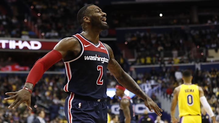 Dec 16, 2018; Washington, DC, USA; Washington Wizards guard John Wall (2) reacts on the court against the Los Angeles Lakers in the second quarter at Capital One Arena. Mandatory Credit: Geoff Burke-Imagn Images
