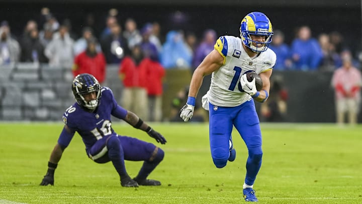 Dec 10, 2023; Baltimore, Maryland, USA;  Los Angeles Rams wide receiver Cooper Kupp (10) runs past Baltimore Ravens cornerback Arthur Maulet (10) after a catch during the second  half at M&T Bank Stadium. Mandatory Credit: Tommy Gilligan-Imagn Images