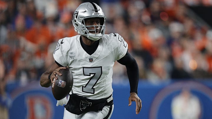 Nov 6, 2025; Denver, Colorado, USA; Las Vegas Raiders quarterback Geno Smith (7) drops back to pass against the Denver Broncos during the first half at Empower Field at Mile High. Mandatory Credit: Isaiah J. Downing-Imagn Images