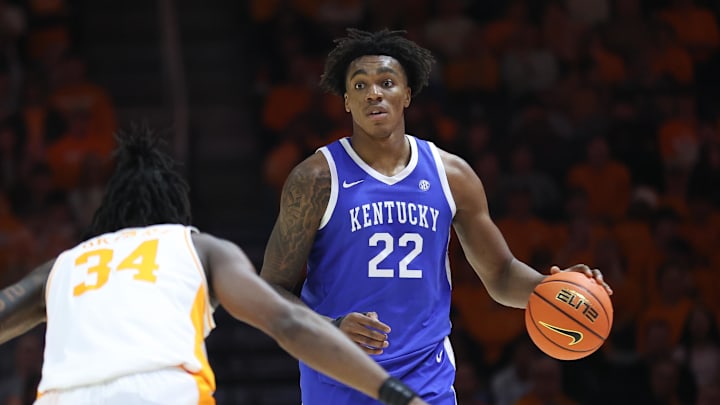 Jan 28, 2025; Knoxville, Tennessee, USA; Kentucky Wildcats center Amari Williams (22) brings the ball up court against Tennessee Volunteers forward Felix Okpara (34) during the second half at Thompson-Boling Arena at Food City Center. Mandatory Credit: Randy Sartin-Imagn Images