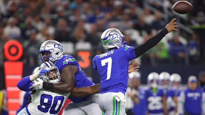 Nov 30, 2023; Arlington, Texas, USA; Dallas Cowboys defensive end DeMarcus Lawrence (90) pressures Seattle Seahawks quarterback Geno Smith (7) during the first half at AT&T Stadium.
