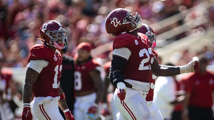 Oct 12, 2024; Tuscaloosa, Alabama, USA; Alabama Crimson Tide defensive back Malachi Moore (13), lineman LT Overton (22), and defensive back Jaylen Mbakwe (9) react to recovering a fumble by the South Carolina Gamecocks during the fourth quarter at Bryant-Denny Stadium. Mandatory Credit: Will McLelland-Imagn Images
