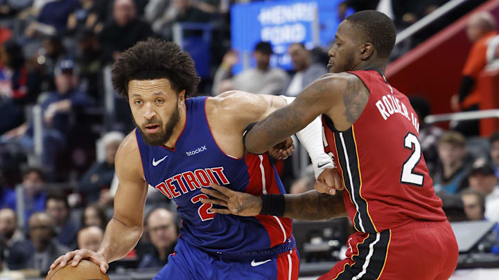 Dec 16, 2024; Detroit, Michigan, USA; Detroit Pistons guard Cade Cunningham (2) dribbles as Miami Heat guard Terry Rozier (2) defends in the second half at Little Caesars Arena. Mandatory Credit: Rick Osentoski-Imagn Images