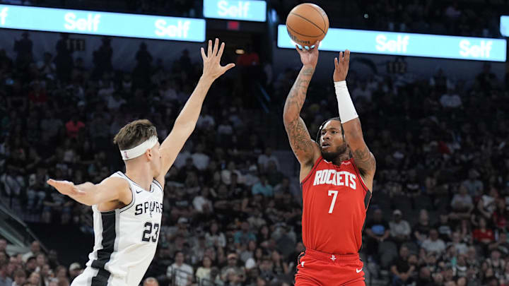 Oct 26, 2024; San Antonio, Texas, USA;  Houston Rockets forward Cam Whitmore (7) shoots over San Antonio Spurs forward Zach Collins (23) in the first half at Frost Bank Center. Mandatory Credit: Daniel Dunn-Imagn Images