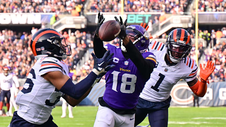 Nov 24, 2024; Chicago, Illinois, USA; Chicago Bears defensive back Jonathan Owens (36) is called for pass interference as he intercepts a pass intended for Minnesota Vikings wide receiver Justin Jefferson (18) during the second quarter at Soldier Field. Mandatory Credit: Daniel Bartel-Imagn Images