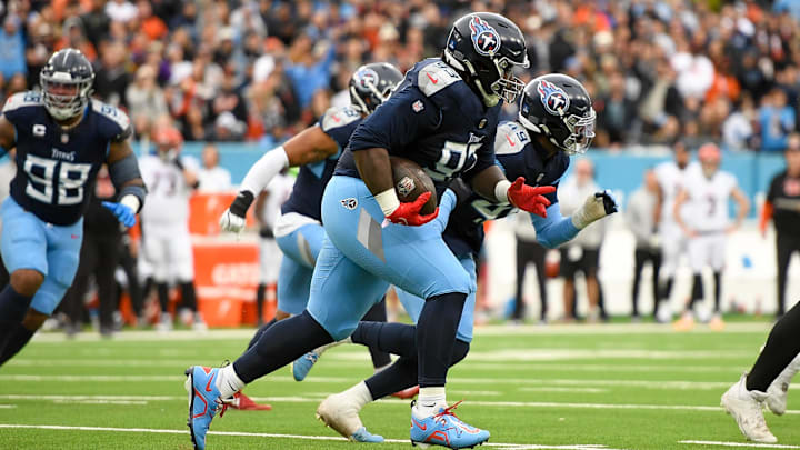 Dec 15, 2024; Nashville, Tennessee, USA;  Tennessee Titans defensive tackle T'Vondre Sweat (93) runs the ball after the fumble recovery against the Cincinnati Bengals during the first half at Nissan Stadium. Mandatory Credit: Steve Roberts-Imagn Images