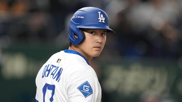 Mar 16, 2025; Bunkyo, Tokyo, Japan; Los Angeles Dodgers designated hitter Shohei Ohtani (17) waits to bat during the first inning against the Hanshin Tigers at Tokyo Dome. Mandatory Credit: Darren Yamashita-Imagn Images