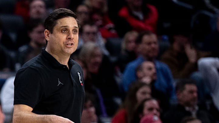 Cincinnati Bearcats head coach Wes Miller speaks to his players in the second half of the NCAA basketball game between Cincinnati Bearcats and Evansville Purple Aces at Fifth Third Arena in Cincinnati on Friday, Dec. 29, 2023.